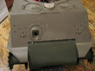 Work on the front end.  Add the Transmission cover and remove gun travel lock mounts.