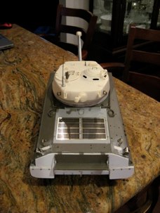 Engine deck replaced with resin kit from Shumo.  Aimee has chosen to change the back plate, add mud skirt, and built a late style exhaust deflector.