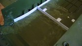 We decided to use some liquid plastic to pour in (just like cement).  Under the transmissions, we'll pour it to the proper height (3/8 inch), and in the rest of the tank, pour in just enough to stiffen it up and plug all the holes in the bottom ¼ inch).  First step was to form up the hull, to keep the liquid plastic out of the suspension.