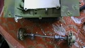 To cut down on weight and use as much as the Sturmtiger as possible, we'll use the stock idler wheels, but make a few modifications.  To begin, we split the idlers apart.  They're pretty simple, and have a shaft extending through the inside half into the tank's hull.  They've got a raised collar which surrounded the shaft.  It looked much the same as did the hull's penetration point for the rear axle, which was also surrounded by a collar.  We need to reinforce this.