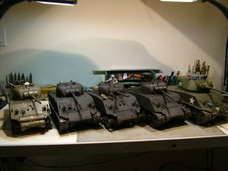Alright, well the tools were drying and the group of Bastogne tanks needed painting so here where we are.