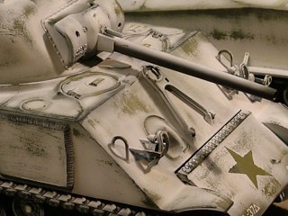 After applying the hairspray in several generous coats from an aerosol can I set the tanks aside to dry for a night or two. Then using Tamiya white acrylic (about 30%) heavily thinned with a combination of Tamiya thinner (about 20%) plus isopropyl alcohol ( approximately 30%) and distilled water (20%) I shot several light coats of whitewash. I started in the center of each panel or section and worked my way out to the edges, intentionally leaving more green visible at all of the edges and corner. This helps to show subtle signs of wear on the white paint.