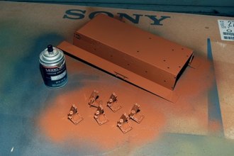 Construction begins with priming the Lower pan and Suspension mounts with Testors Model Master Enamel spray paint.