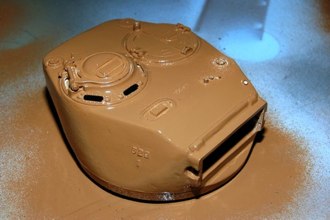 We tend to forget resin is a chemical process that may not be finished. I continue with the painting of my turret by finishing the can of light earth and moving on with a can of dark tan.