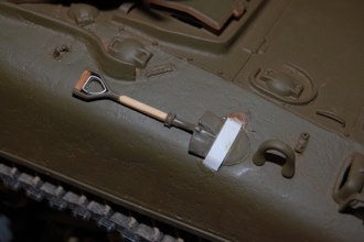 The shovel got a wooden handle, metal retainer, and the hold down strip.  I am using generous amounts of CA to simulate the rough weld you see on the real thing.