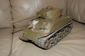 An OD coat was applied for the December battle but more putty work and sanding was need to fair in the brush guards and finish my work on the front glacis.  Now is the time to add other surface details.