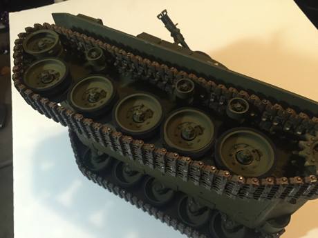 Drive train is based off components from a Tamiya Leopard 1A4 and the road wheels were turned down on a lathe and had the Sherman rubber stretched to fit.