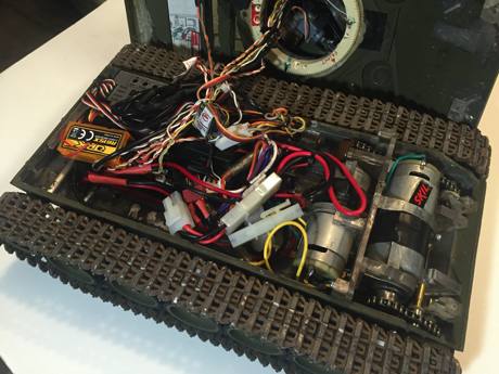 Inside is a tight package with Standard Tamiya Sherman Electronics and custom chain drive gearboxes based off drill motors. An Interim owner added a charging system and a speaker switch.