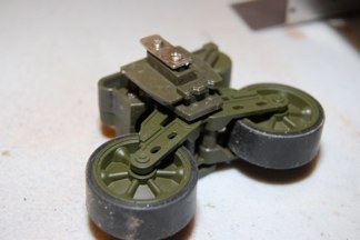 The usual bogie work includes unscrewing the retainer parts and slicing the column off that will become the backing inside the hull.