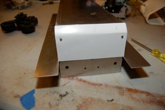 I always use the small screws to stiffen the hull as tamiya provides.
