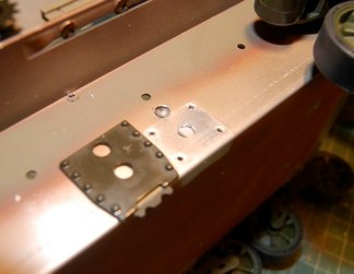 use the older hvss return rollers as a guide and drill two holes to match the posts on the vvss trucks.