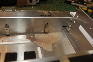 the preiviously removed piece now holds the suspension to the hull.  I also mounted the mato idler by using it as a template to drill new holes in the hull.