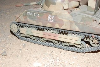 LATER MOD IS THE WOOD SLATS TO prevent suicide attacks between the treads.