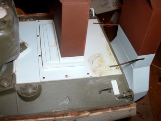 I did two for now, but on a later vehicle they may all be replaced.  Moving backward I added more of the hex bolts to the engine deck and bent brass strip to replicate the braces for the ducts.  I primed more parts with the red primer, including the full upper hood sections.