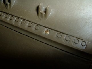 I was trying to figure out a good way to hold the transmission cover adapter in place without the tape provided or gluing and I came up with .90 hex head bolts that match the molded in bolt heads completely.