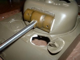 I began the turret conversion by borrowing the correct M34 mantlet and gun mount from a 21st century toys 1/18 Sherman.  I have accepted the scale issue to compensate for the 105 mount being completely different than those used by late M4A3 75mm versions.