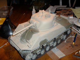 Now I begin the serious painting by applying and Testors OD enamel base coat and over spraying with acrylic Tamiya Buff from my new Iwata airbrush.  (I won it in a raffle at Chilicon in May)  I did these two coats mostly freehand with a few paper masks.