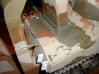 After a few fits and starts I have the initial paint scheme in place.  I felt detail was lacking on the rear of the tank so I began adding bolts and grab handles to the engine deck.  Brass hinges were added to the rear deck to simulate the rear storage rack that was removed on many of these vehicles.