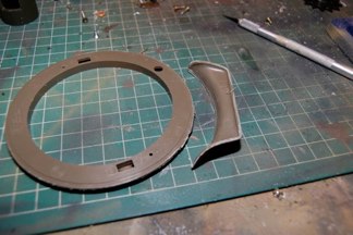 Cut the lower bustle off and glue it to the upper turret half