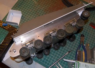 Shermans had the option of sand skirts along their lower hull.  Most were not used in the eto but the bracket remained.  to simulate this fairing, I have glued styrene strip to the hull.