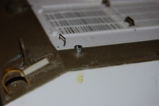 The Idler adjustment wrench had a bracket made from tube with a pin on a chain.