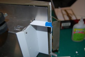 The sides stepped downwards to form the armored exhaust cover