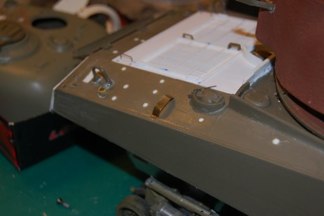 I choose to enhance my stowage by building the accurate brackets from brass, and adding the straps to the tools.