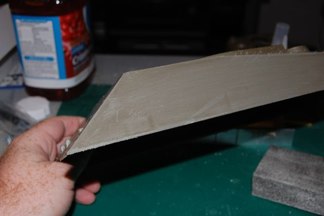 remove the Sandskirt extension and the front fenders.  I use a razor saw and then I sand the entire side with a rough grit sanding sponge to even it out.