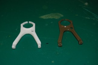 Replacements are available for the Travel lock but on a budget you can replace it by cutting the Tamiya piece and shortening it.