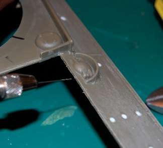 I really love the small details.  The Fuel filler caps on sHermans were Hinged, armored lids with a steel retaining pin.  I choose to add the pin as it is noticeable to shermanohlics.  Step one, use micro drill to make the hole for the pin.