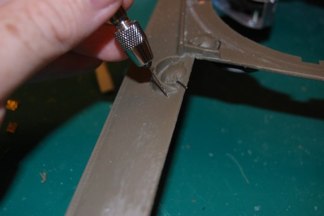 Next I drill the mounting hole for the chain that keeps the pin on the hull when open.  Location is approximate.  I have seen it in many places on the hull.