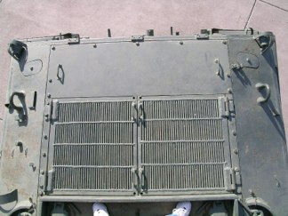 The real deck has a large one piece in the rear, two engine doors, and a flat piece toward the turret.  The grilles are welded rod with a metal stiffener above.