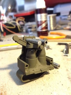 Unit painted and assembled.  I drill two holes through the rocker part and add two .40 srews to hold the assembly together.