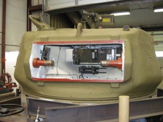 Turret, with mantlet removed, shows trunnions, turret interior and the radio boxes.  Just below are the stored M3 grease guns.