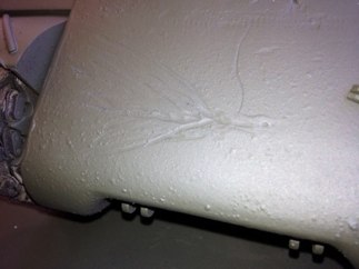 Our example has the remains of a wicked HEAT round scar on the trans cover.  I did my best to add it with a motor tool.