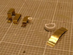 Using styrene and brass rod, strip, sheet, and tubing I made several types of hangers for each of the tools. Then I went into my spares box and used some extra PE pieces that I either modified or scratch built just using the left over PE fret.