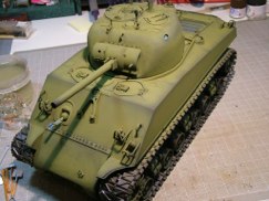 The dark color was applied as a pre-shade so it also serves as the first layer of weathering. Meaning that as the color coats are applied I intentionally let the black undercoat show through, especially at the edges and soft corners.