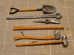 As promised here is the next round of in-process pictures showing the progression of the tools. All of the metal parts were painted with a mixture of matte black and gun metal acrylic paint. Once dried the paint was "scuffed off" with a damp Q-tip and rolled up paper towel.