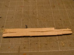 I added the commonly seen wooden "shelf" across the front of the transmission cover, and captured between the front fenders. But I designed mine in such a way that I can still add the tow cable without it interfering with the stowage shelf.