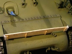 I then used two pieces of .25 X .080 Balsa strip to make the structural wooden planks. After cutting them to length, I used a small chisel to split and chip the edges giving them that very old used look of discarded lumber (perhaps the crew picked them up in the rubble a bombed out building somewhere in France). I glued the two strips together using wood glue and then added support batons to the underneath side from additional pieces of balsa strip. Once I was happy with the overall size and shape I used a course rasp to add scratches and gouges to stay consistent with the look. They should look pretty cool with chipped and peeled paint.