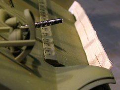 I then cut out a section of the wood to make a pass through where the tow cable will be attached to it's cable tie down lower down on the transmission cover.