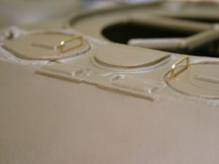 I had some thin gauge brass rod stock, that I thought looked appropriate, so I used that to create the hand grabs on the two front hull hatches. I will generally make grab handles and tie downs and little thin in scale, as I think it helps to offset some of the chunkiness of some of the molded plastic parts.