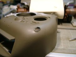 After I was happy with the overall look and shape of the opening I set about making the raised lip around it. I used thin guage solder bent around a small round file, that had a diameter that was slightly smaller then the opening in the turret.