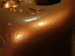 Rustoleum has a line of paints called "Hammered" and it's intended to replicate hand hammered copper or bronze. The only colors they had were mettalics but I thought I would give it a try. 

Using an extra Sherman turret I simply sprayed a few coats of this stuff straight outta the can. Goes on like any other enamel so I started with a few light coats to give it some tooth and ensure good adhesion, then ended with two relatively wet coats and set it aside to dry for a few hours. These pics don't do it justice as the sheen really reflects the light. But I think once you spray a primer gray or matte olive drab finish over it, it should look pretty good.