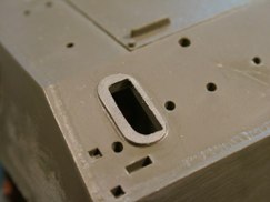 I started by removing the molded intake covers using a micro-saw. Then using a burr bit in the Dremel tool and files I leveled everything off, leaving the molded on base plate of the intake.