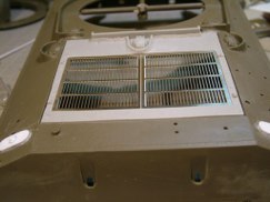 Because the resin part needed some tweaking so did the PE grill that fits into it's recessed opening. Scraping and file work on the the resin lip, plus lots of dry fitting and the grill dropped into place. Then just to add support I also made a brace down the center of the opening to help support the PE grill from being bent inward.