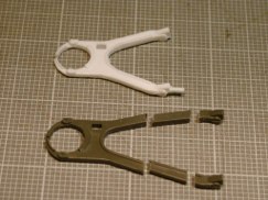 I started by cutting a section of plastic out of each leg. By removing the center section I could still maintain the cross sectional detail of the legs.
