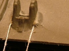 Then using fine cotton thread I sliced the mounting points off of the front glacis. Using the thread means you lose very little material and you can cut irregular shapes and hard to reach places.