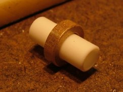 I then cut 1/2" long pieces of the styrene rod to act as an axel that the wheel collet would spin about.