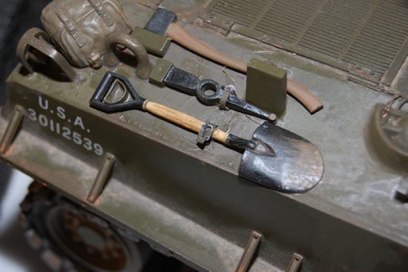 Tools get the wood handle and wire brackets with tape hold downs.